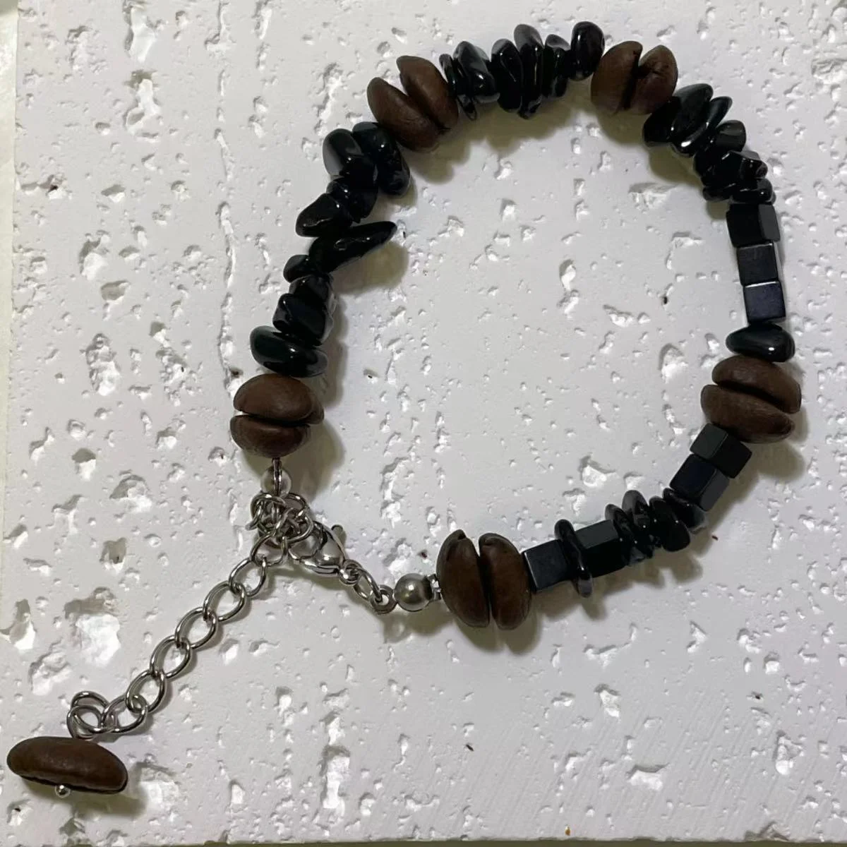 Coffee Bean & Black Stone Bracelet Image Coffee Bean & Black Stone Bracelet - Stylish Coffee Bean Accessory