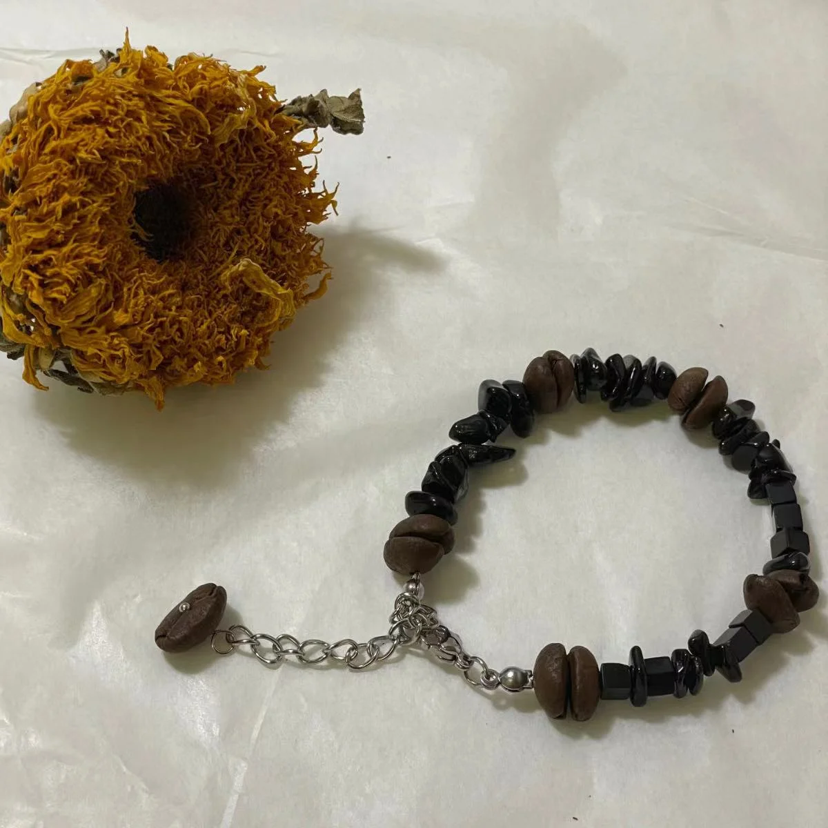 Coffee Bean & Black Stone Bracelet Image Coffee Bean & Black Stone Bracelet - Stylish Coffee Bean Accessory