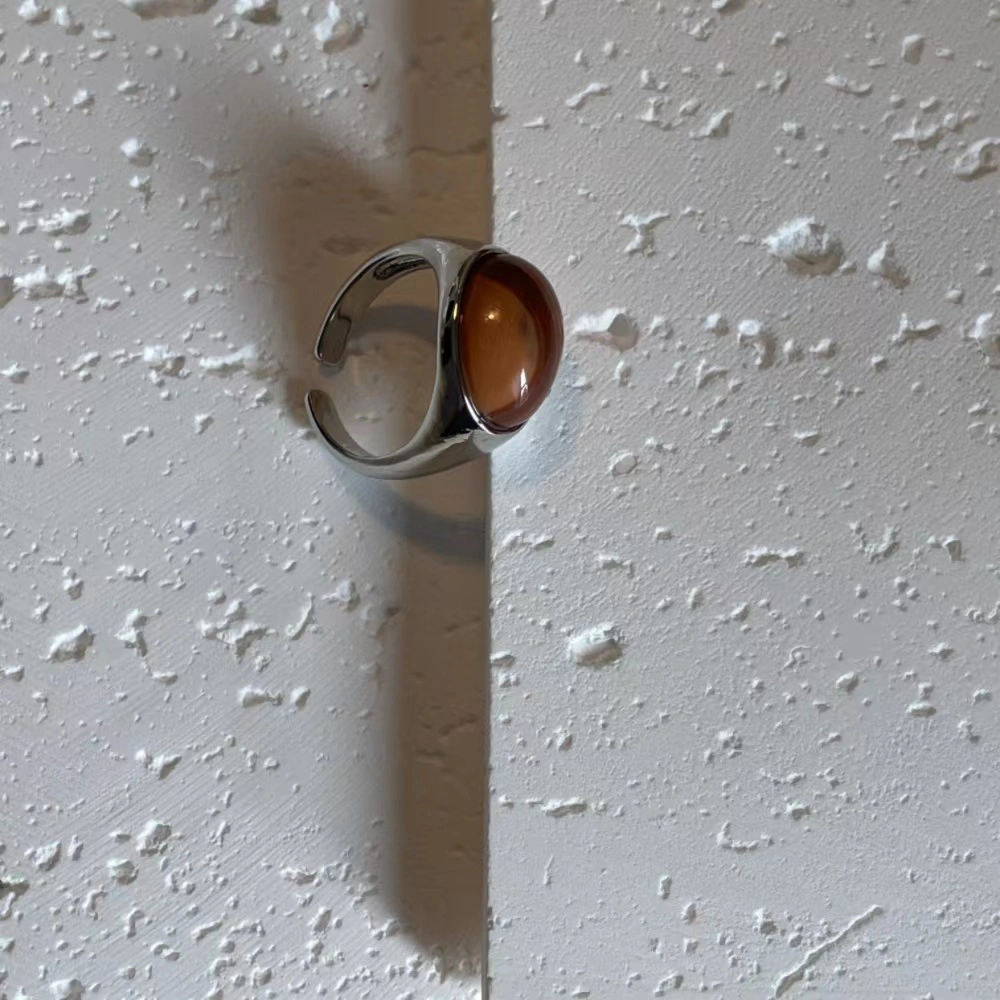 Honey jade stone alloy open ring on a white base.