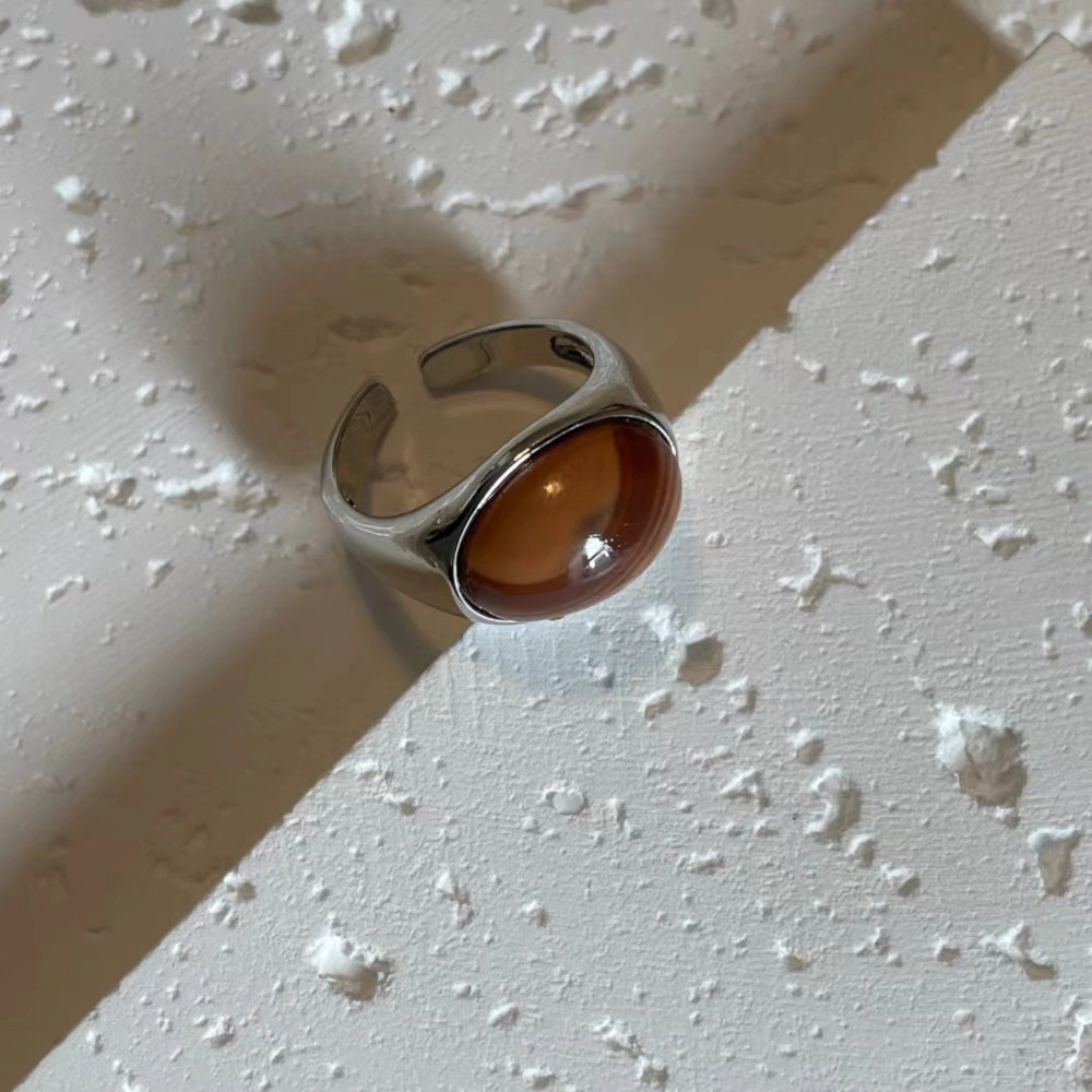 Honey jade stone alloy open ring on a white base.