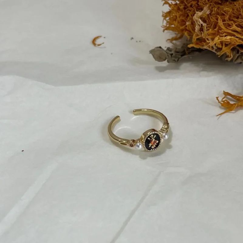 14K Vintage Black Iris Enamel Open Ring on fabric with dried sunflower