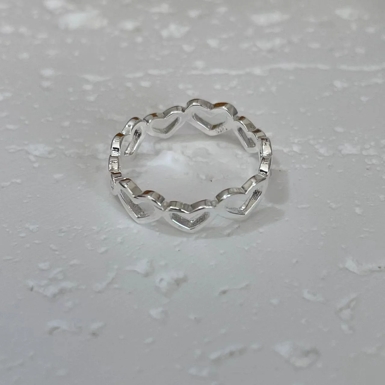 Silver-Plated Hollow Heart Open Ring on white base