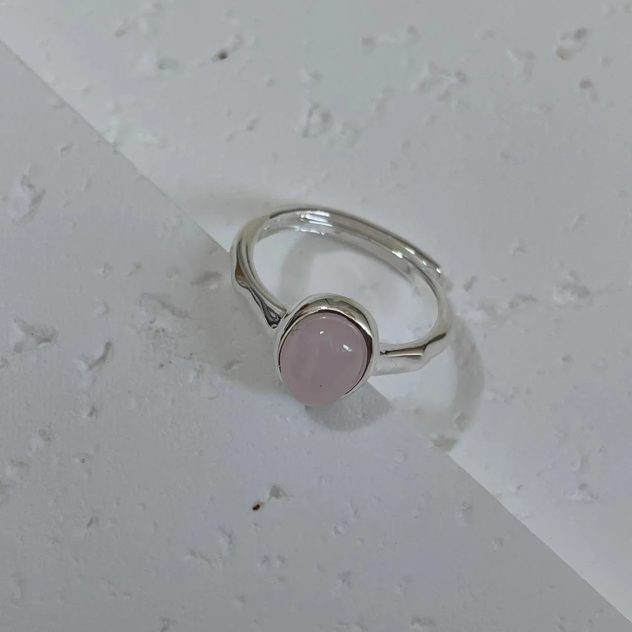 Strawberry Quartz Silver-Plated Open Ring tilted on white base