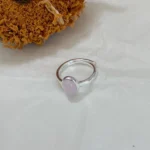 Strawberry Quartz Silver-Plated Open Ring on white fabric with dried sunflower