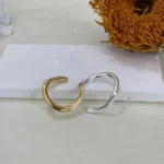 925 Sterling Silver Gold & Silver Dual Band Ring with dried sunflower on white base