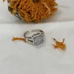 925 Sterling Silver White Topaz Ring on fabric with dried sunflower