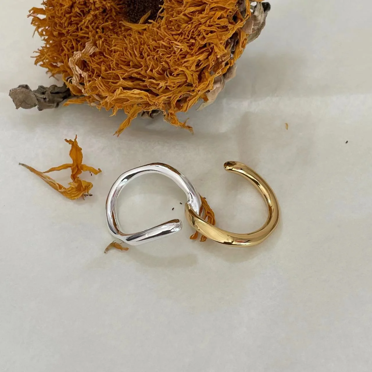 925 Sterling Silver Gold & Silver Dual Band Ring on fabric with sunflower